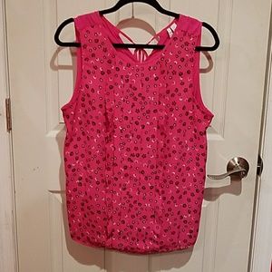 Sleeveless pink blouse with ruffles